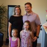 Dr. Stephenie Tornberg of ROW Health poses for a photo alongside husband Ben and two daughters, Madison and Teagan. Photo by Conor Wilson/Valley Record