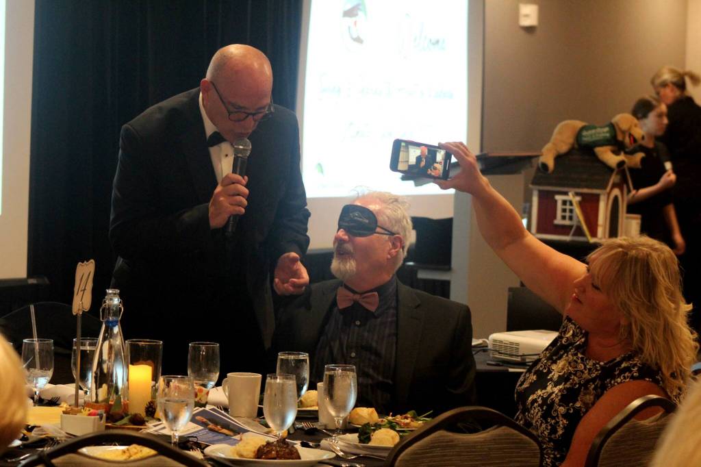 Clark Roberts explains how to eat without sight, as guests participate in Dining in the Dark. Photo by Conor Wilson/Valley Record