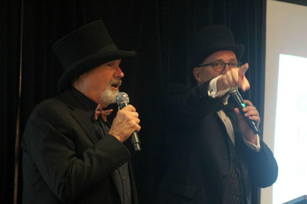 Clark Roberts and Larry Snyder auction items off to benefit Ultimate Vision. Photo by Conor Wilson/Valley Record.