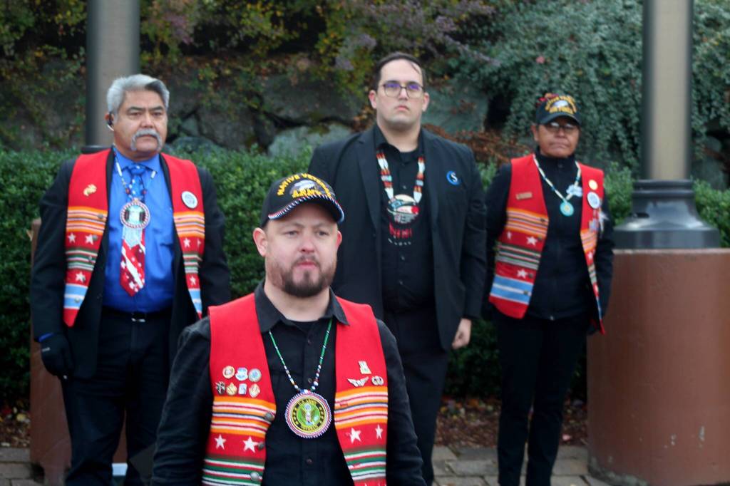 Josh Fackrell (front), an Army Veteran and Snoqualmie Tribal member, leads the Tribes Honor Guard in a flag ceremony outside the casino.