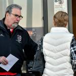 Mike Raughter, a union representative with the Marysville Albertsons, hands a leaflet to a shopper during an informational campaign on Wednesday. Raughter was one of less than a dozen grocery store workers handing out leaflets to shoppers about the proposed merger between Albertsons and Kroger. (Mike Henneke / The Herald)