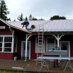 Workers fix the roof at North Bend Train Depot in Taylor Park on June 17. Photo by Conor Wilson/Valley Record