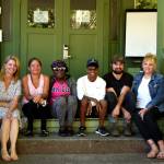 Jennifer Kirk (left), the executive director of Snoqualmie Valley Shelter Services, sits with shelter residents and staff on the steps of their downtown shelter.