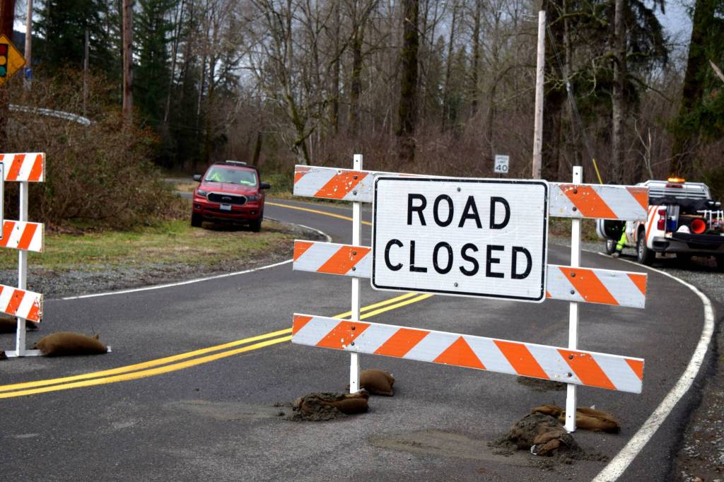 City of Snoqualmie closes Mill Pond road after a fallen tree rests on power lines. Photo Conor Wilson/Valley Record.