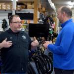 Brian Davis (R) speaks to Erik Alston, owner of Singletrack Cycles.