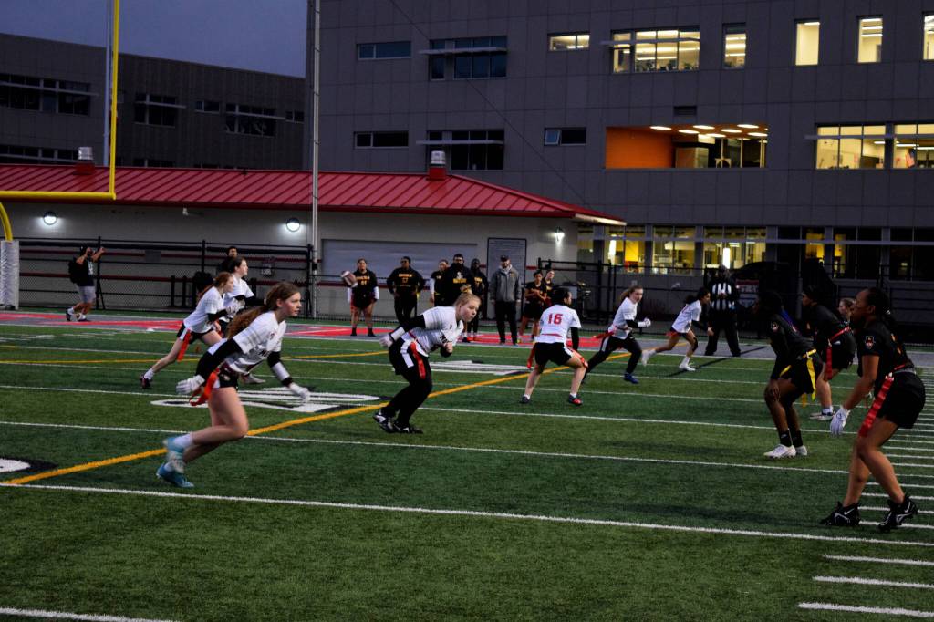 Photo by Conor Wilson/Valley Record 
Mount Sis junior varsity flag football team snaps the ball against Lincoln High School.