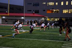 Photo by Conor Wilson/Valley Record 
Mount Sis junior varsity flag football team snaps the ball against Lincoln High School.