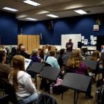 Photo by Conor Wilson/Valley Record.
Band Director Mike Herb and Dean Snavely speak to members of the SnoValley Winds band before its first rehearsal.