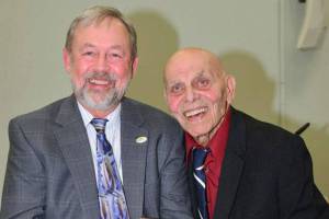 Burt Mann (right) stands next to former North Bend Mayor Ken Hearing in 2018. File photo.