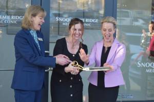 Hospital CEO Renee Jensen (middle), stands with Snoqualmie Mayor Katherine Ross (left) and Dr. Tammy Moore, during a ribbon cutting ceremony outside the Snoqualmie Ridge Medical Clinic on Feb. 8. Photo Conor Wilson/Valley Record.