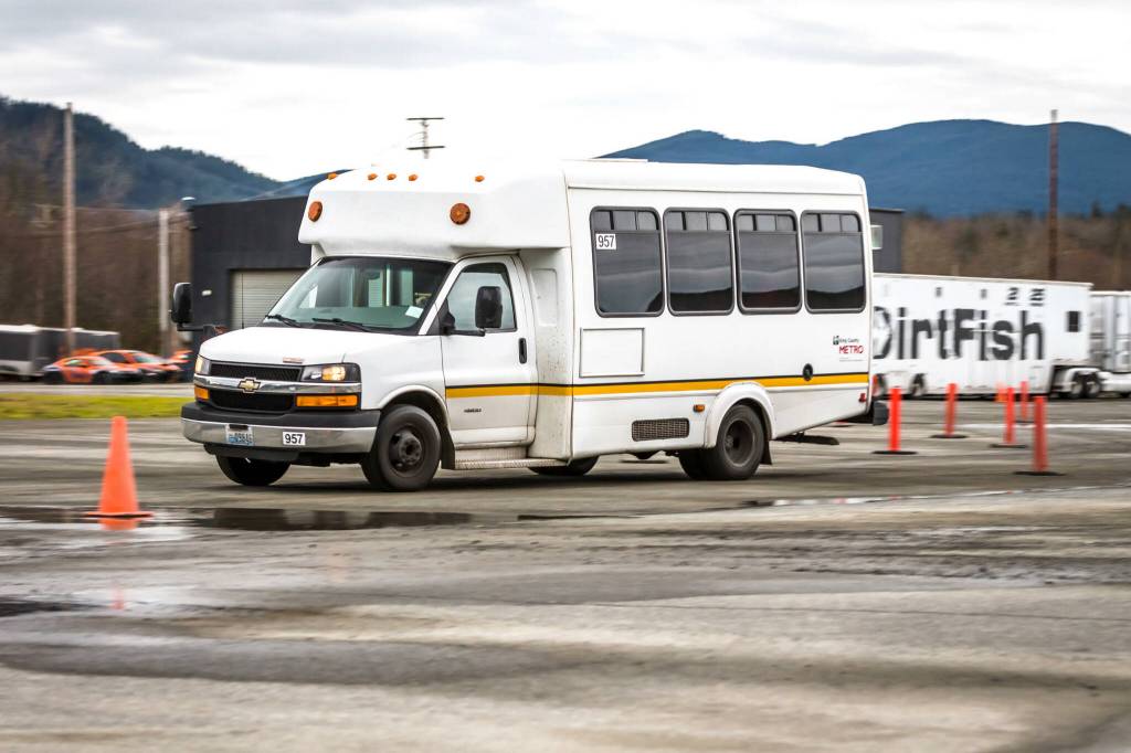 Snoqualmie Valley Transportation  (SVT) buses negotiate an obstacle course at DirtFish rally car school in Snoqualmie, during a driver safety training event. Photo courtesy of SVT.