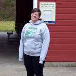 Conor Wilson / Valley Record 
Lindsay Gilliam, executive director of the Carnation Farmers Market, poses in front of the Red Barn at King Countys Tolt-McDonald Park, the markets new home.