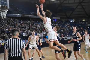 Trevor Hennig (#4) catches a passes in Mount Sis loss to Olympia on March. 3. Photo courtesy of Calder Productions.