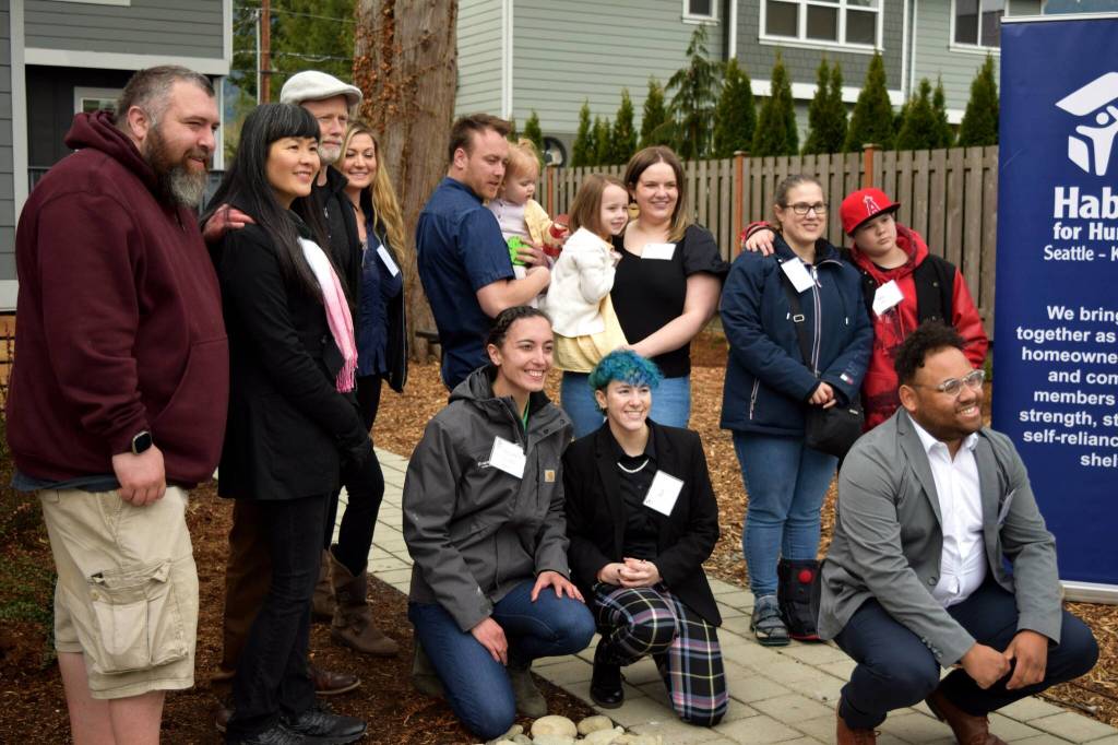 Photos by Conor Wilson/Valley Record.
Some of the new homeowners at Tyler Town in North Bend pose for a group photo with Habitat for Humanity staff.