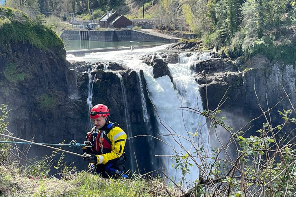 A firefighter starts to rappel to the Snoqualmie River near Snoqualmie Falls as part of a river rescue training session. Courtesy photo, Puget Sound Fire.