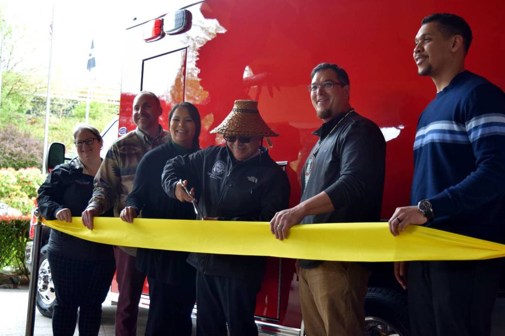 Snoqualmie Tribal Chairmen Robert de los Angeles (center) cuts a ribbon to celebrate the new emergency aid vehicle alongside members of the Snoqualmie Tribal Council. From left: Shauna Shipp-Martinez, Christopher Castleberry, Melynda Digre, Robert de los Angeles, Steve de los Angeles, David Maddock. All photos Conor Wilson and William Shaw/Valley Record.