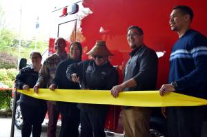 Snoqualmie Tribal Chairmen Robert de los Angeles (center) cuts a ribbon to celebrate the new emergency aid vehicle alongside members of the Snoqualmie Tribal Council.  From left: Shauna Shipp-Martinez, Christopher Castleberry, Melynda Digre, Robert de los Angeles, Steve de los Angeles, David Maddock.  All photos Conor Wilson and William Shaw/Valley Record.