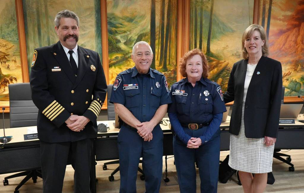 Courtesy of the City of Snoqualmie
Catherine Cotton, center right, poses for a photo after learning about her lifetime achievement award. From left: Fire Chief Mark Correira, Robert Angrisano, Cotton and Snoqualmie Mayor Katherine Ross.