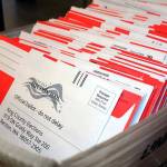 A stack of sealed voter ballots wait to be counted by King County Officials. File photo.