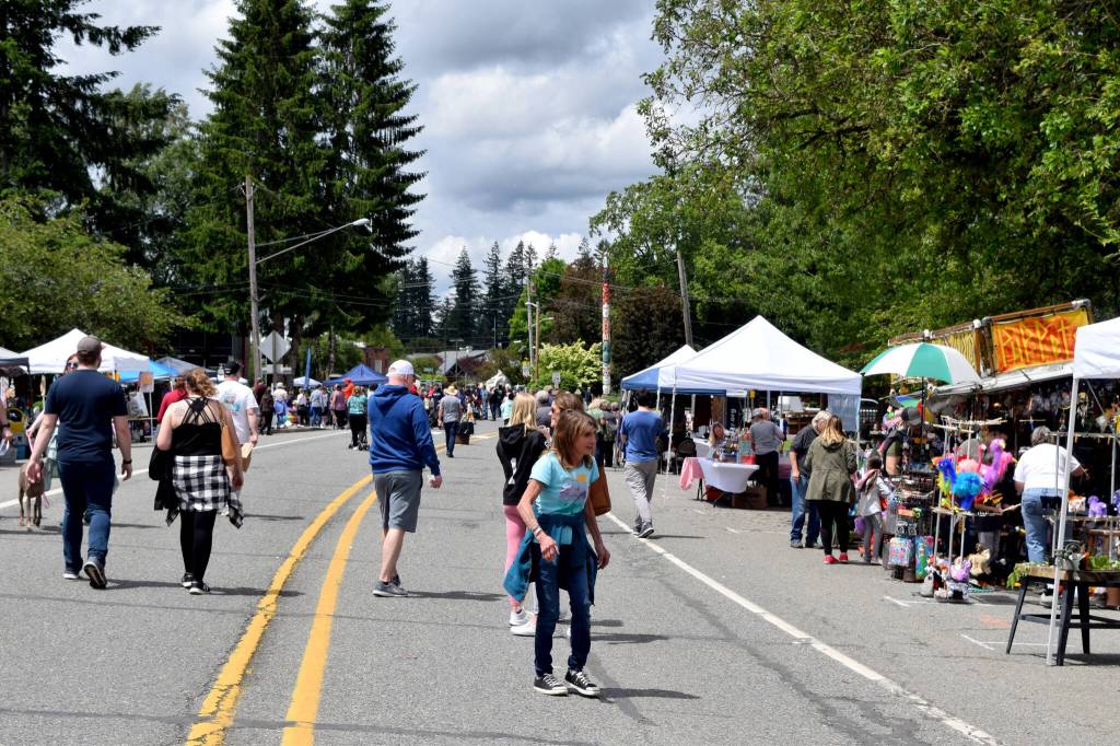 Residents walk along Redmond-Fall City Road. Photo by Conor Wilson/Valley Record