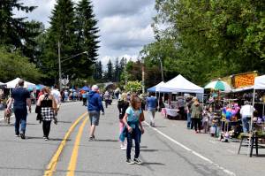 Residents walk along Redmond-Fall City Road. Photo by Conor Wilson/Valley Record