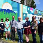 From left: North Bend Councilmember Mary Miller, Pressed on Main owner Hayley Raff, Artist Sarah Hugues, SVSD Superintendent Dan Schlotfeldt, North Bend Mayor Rob McFarland, Two Rivers student Ava Mulligan, Two River Principal Catherine Fredenburg, and Two Rivers Internship Coordinator Chrissy Riley. Photo Conor Wilson/Valley Record.