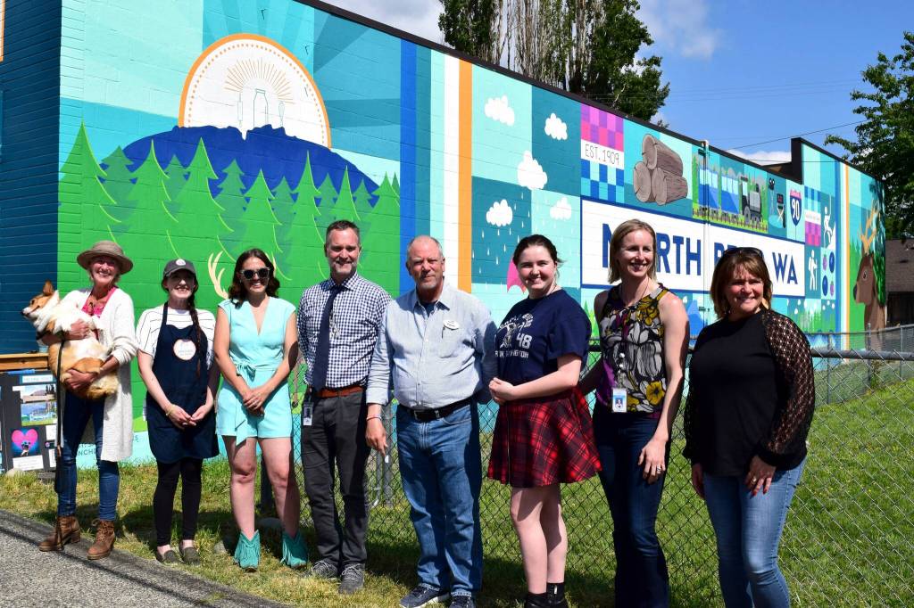 Photos by Conor Wilson/Valley Record
From left: North Bend Councilmember Mary Miller, Pressed on Main owner Hayley Raff, Artist Sarah Hugues, SVSD Superintendent Dan Schlotfeldt, North Bend Mayor Rob McFarland, Two Rivers student Ava Mulligan, Two River Principal Catherine Fredenburg, and Two Rivers Internship Coordinator Chrissy Riley.