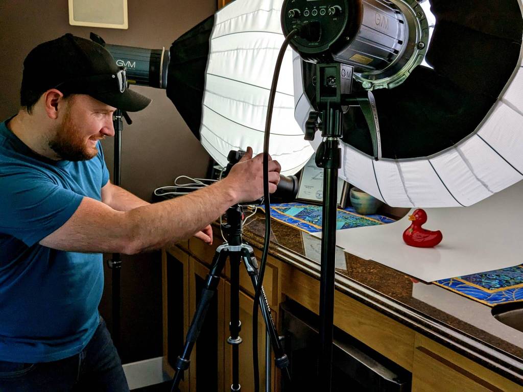 Local photographer Jason Refsland snaps a photo of each duck.