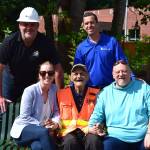 Burt Mann (bottom center) poses for a photo with community members who helped install a sprinkler system at his garden. Top row, from left: Tom Gallagher and Dan Waddell. Bottom Row: Meghan Remington, Mann and Tom Armour. Photo by Conor Wilson/Valley Record.
