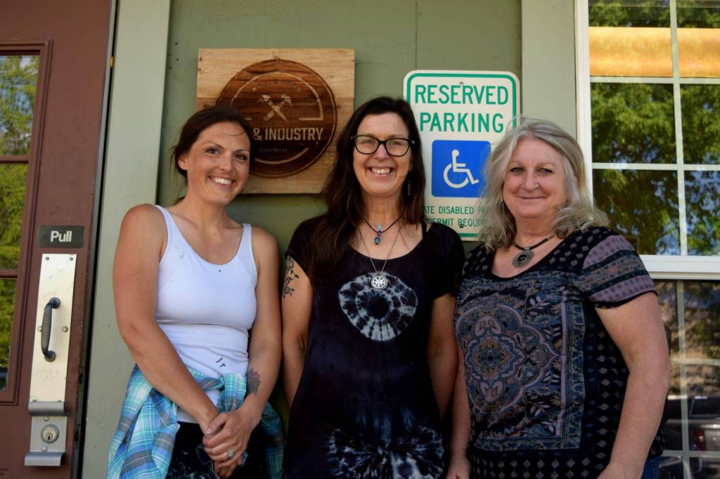 Photo by Conor Wilson/Valley Record.
Members of North Bend Art & Industry pose for a photo outside their new space in downtown North Bend. From left: Sarah Hughes, Ellen Rowen, Deb Landers. NBA&I will host an open house this Saturday.