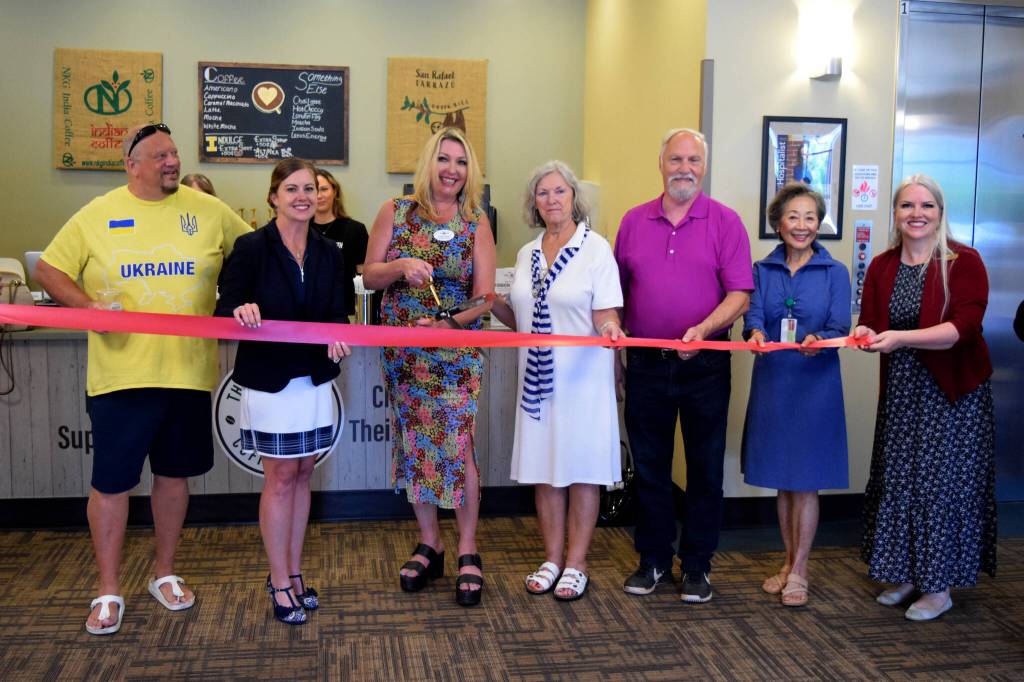 Tonya Guinn stands next to her parents celebrating the opening of her second coffee shop inside Snoqualmie Valley Hospital. From left: Tom Armour, SVH CEO Renee Jensen, Guinn, her parents, Hospital Board Vice President Jen Carter, and boardmember Emma Herron. Photo by Conor Wilson/Valley Record.