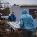Volunteers build panel homes. (Photo courtesy of Tom Armour)