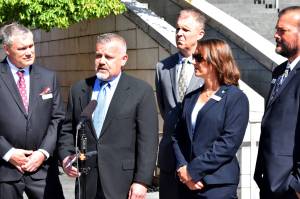 Members of the Carnation City Council speak to reporters outside Seattle City Hall on Sept. 5. From left: Tim Harris, Jim Ribail, Ryan Burrell, Adair Hawkins, Dustin Green. Photo by Conor Wilson/Valley Record