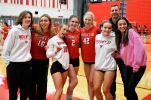 Head Volleyball Coach Brady King Poses for a photo with varsity athletes before a game against Holy Names Academy. Photo Conor Wilson/Valley Record.