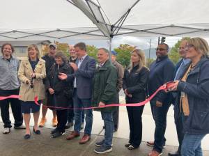 Mayor Katherine Ross, the Snoqualmie City Council, Sen. Mark Mullet and 5th Legislative District Reps. Lisa Callan and Bill Ramos gather to cut a ribbon signifying the completion of the Snoqualmie Parkway Rehabilitation Project. This project aimed to repave the northeast and southwest Snoqualmie Parkway lanes as well as tend to street lighting, ramps, striping and traffic signal systems throughout the 3.5-mile long roadway and other related right-of-way assets. The parkway rehabilitation project is funded entirely by the state dollars awarded to the city by the 2022 Move Ahead Washington Transportation Package. In attendance from left to right: Jolyon Johnson, Katherine Ross, Ethan Benson (back), Lisa Callan, James Mayhew (back), Mark Mullet, Bill Ramos, Bryan Holloway (back), Cara Christensen, Louis Washington and Rob Wotton.
Photo by Cameron Sires/Sound Publishing