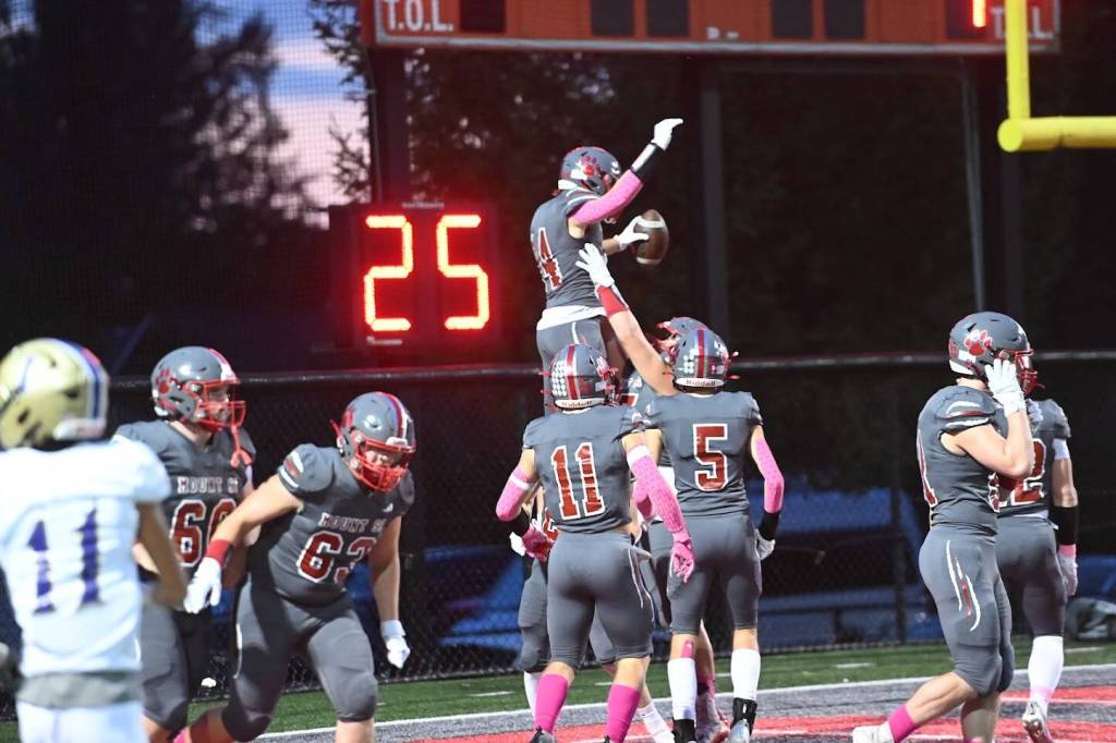 The Wildcats hoist wide receiver Dillon McCaffery after he scores a first quarter touchdown. Photo Courtesy of Calder Productions.