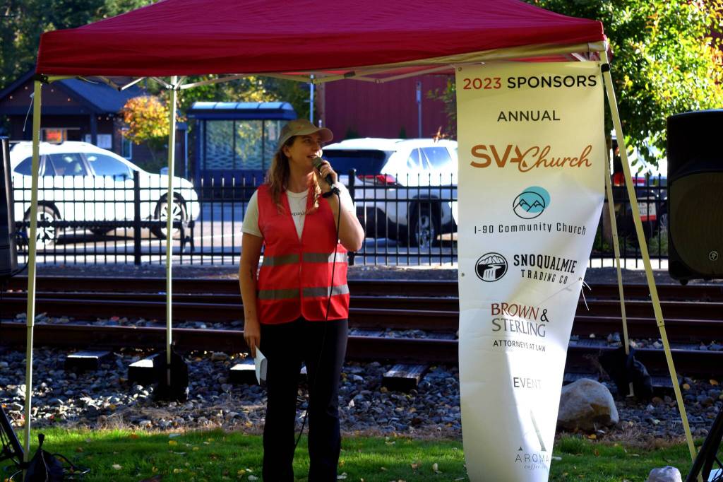 Danielle Cox, excutive director of Love Snoqualmie Valley, delivers a welcome speech at the Volunteer Day kick-off event at Railroad Community Park on Oct. 7. Photo Conor Wilson/Valley Record.