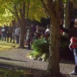 Volunteers stand in Railroad Community Park for a kick-off meeting prior to heading out to volunteer. Photo by Conor Wilson/Valley Record.