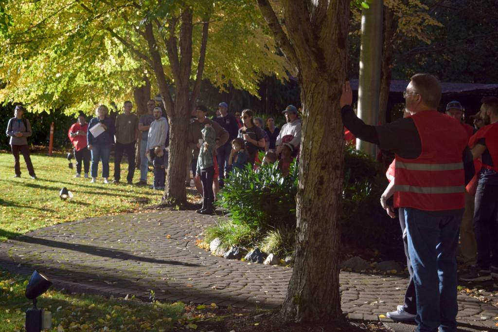 Volunteers stand in Railroad Community Park for a kick-off meeting prior to heading out to volunteer. Photo by Conor Wilson/Valley Record.