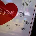 Volunteers write why they love the Snoqualmie Valley. Photo by Conor Wilson/Valley Record.