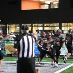 Photo courtesy of Calder Productions. Wildcats celebrate with teammate Jayden Wells after he scores on a pick-six in a 39-14 win over Glacier Peak High School on Nov. 3.