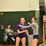 Rylee Booth (purple shirt) and Rachel Maginnis have a laugh in warm-ups. (Photos by Ben Ray / Sound Publishing)
