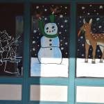 Windows at at North Bend Outlet Mall painted as part of the Holiday Window Painting Contest organized by North Bend Art Industry. Pictured: Artwork by Abby Brunaugh. Photos Conor Wilson/Valley Record.