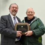 In this file photo, former North Bend Mayor Ken Hearing congratulates Fritz Ribary, who was named the 2018 North Bend Citizen of the Year. File photo