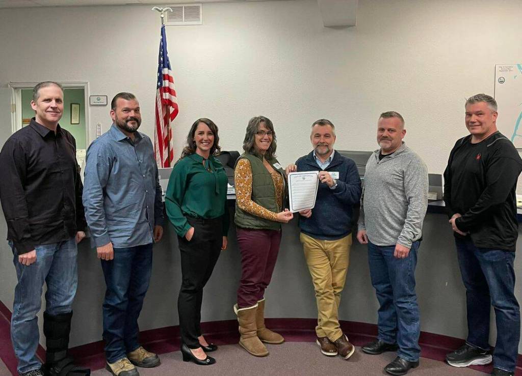 Empower Youth Networks Executive Director Laura Smith and Program Director Jerry Blackburn pose for a photo with the Carnation City Council. Carnation, alongside the cites of Snoqualmie, North Bend, Duvall, the Snoqualmie Tribe and Snoqualmie and Riverview School Districts, recognized January as Mentoring Month in the Snoqualmie Valley. From left: Ryan Burrell, Dusting Green, Adair Hawkins, Smith, Blackburn, Mayor Jim Ribail, Tim Harris. File Photo.