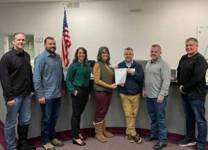 Empower Youth Networks Executive Director Laura Smith and Program Director Jerry Blackburn pose for a photo with the Carnation City Council. Carnation, alongside the cites of Snoqualmie, North Bend, Duvall, the Snoqualmie Tribe and Snoqualmie and Riverview School Districts, recognized January as Mentoring Month in the Snoqualmie Valley. From left: Ryan Burrell, Dusting Green, Adair Hawkins, Smith, Blackburn, Mayor Jim Ribail, Tim Harris. File Photo.