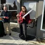 Bethany Lafferty stands next to her shop, located on 4472 Tolt Ave., waiting to cut the ribbon at the grand opening in November. Photo courtesy of Collienne Becker