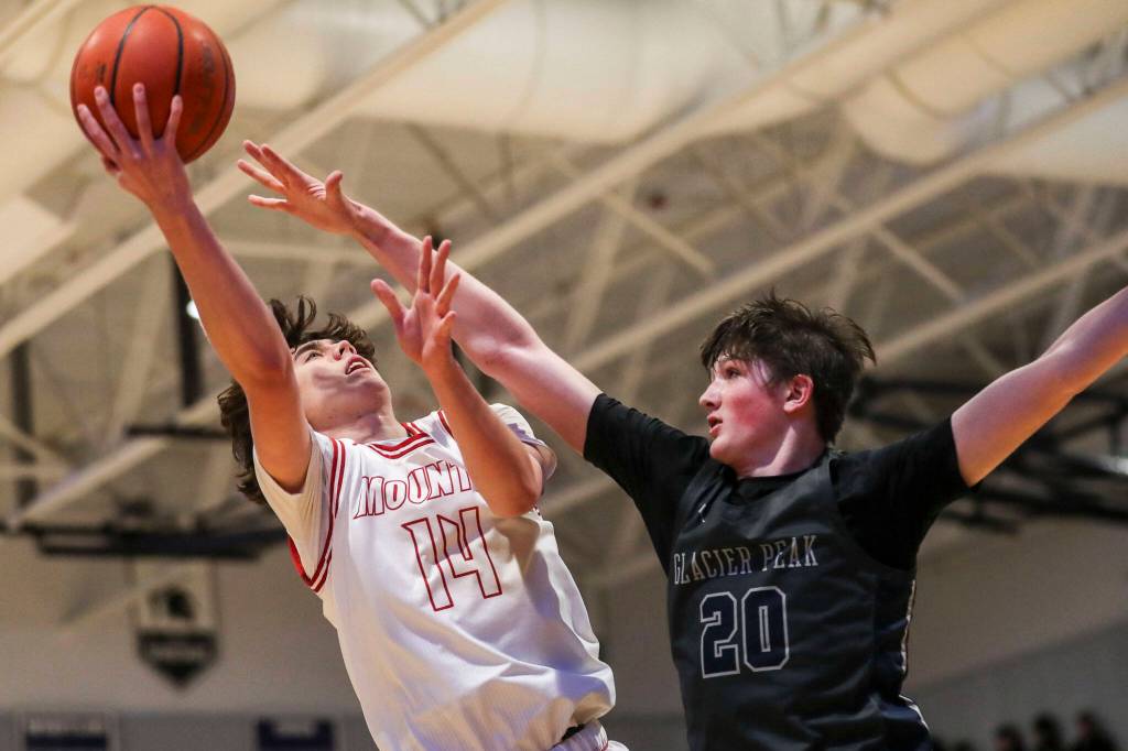 Mount Sis Marcus Heide (14) shoots the ball during a boys Class 4A bi-district title game between Glacier Peak and Mount Si at North Creek High School on Friday, Feb. 16, 2024 in Bothell, Washington. The Wildcats won, 59-53.(Annie Barker / The Herald)