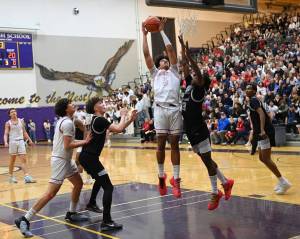Latt Ford puts up a shot for Mount Si in the teams Feb. 24 victory over Kentwood High School. Photo courtesy of Calder Productions