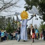 A large, smiling sunflower puppet welcomes a crowd at Depot Park on Saturday, March 30. Photos by Grace Gorenflo/For the Valley Record